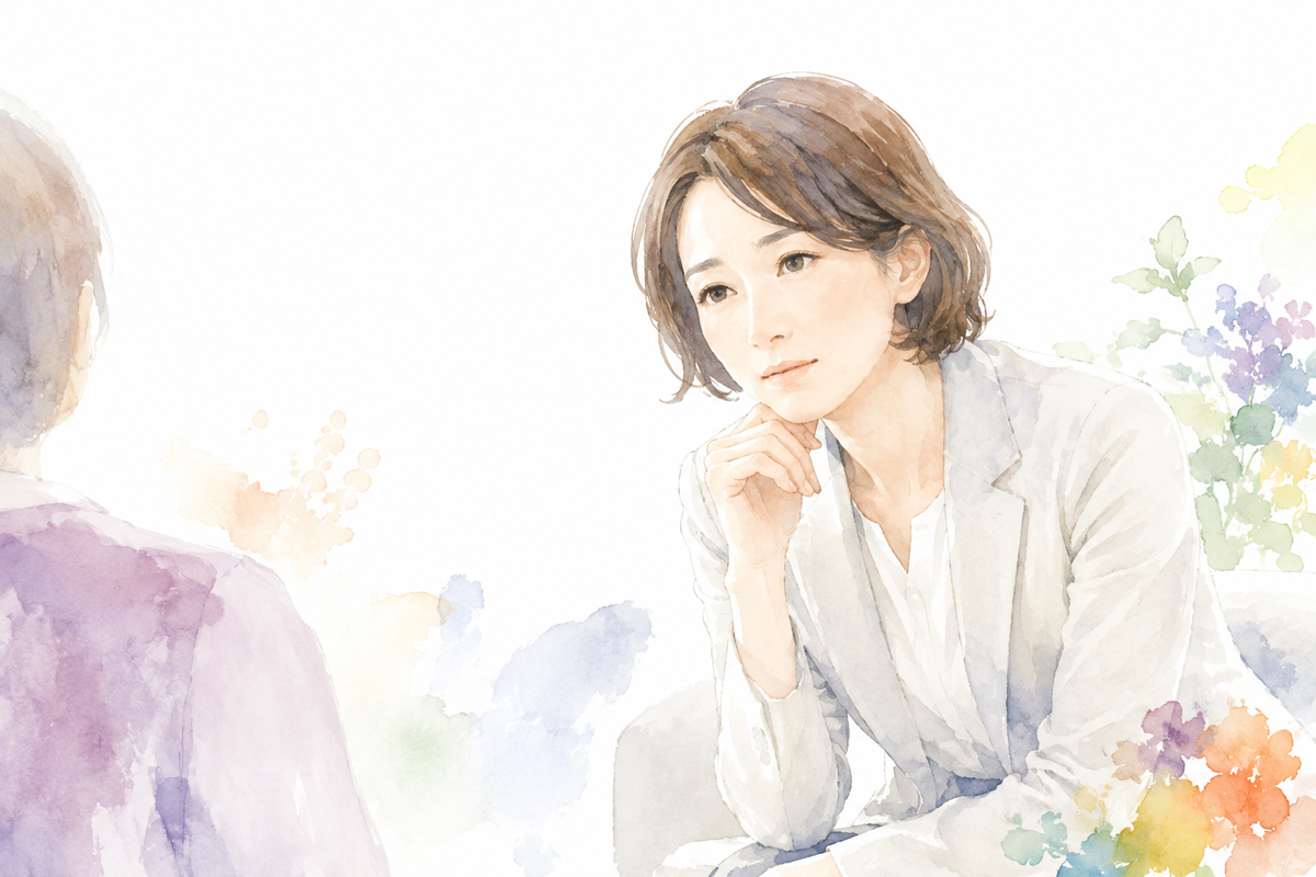 困った表情で少し間を置きながらも、相手の話に耳を傾けようとしているメンター役の人物